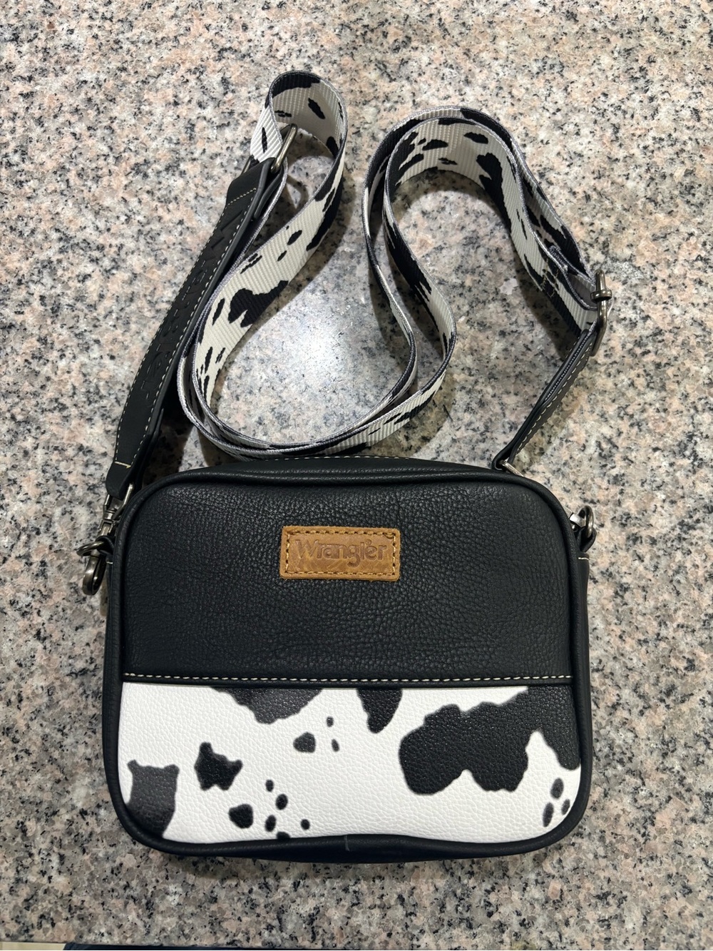 Wrangler Black and White Cowprint Faux Leather Crossbody Bag